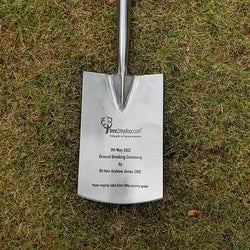 The head of an engraved ceremonial spade