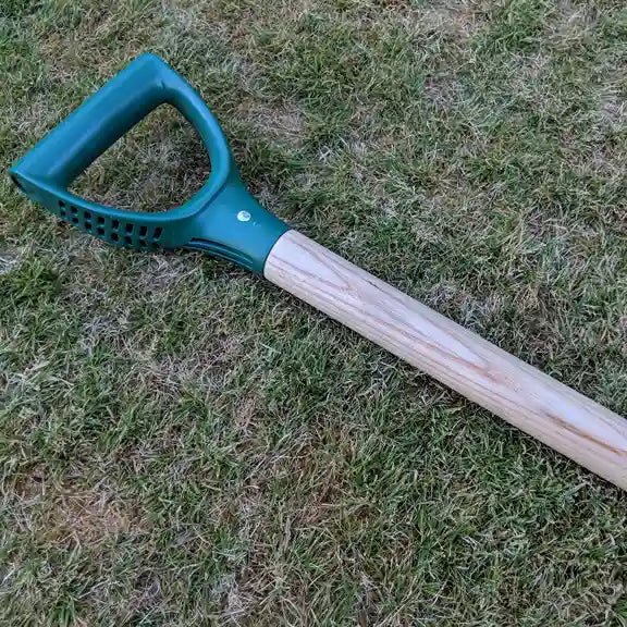 A close up of the plastic handle on the ceremonial spade