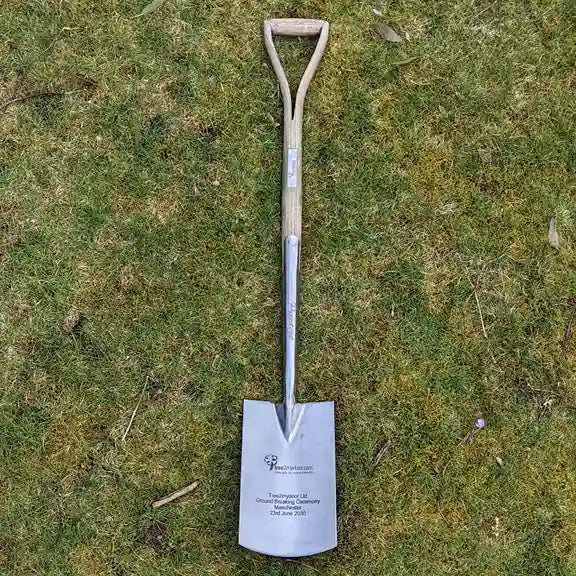 A full image of a solid ash engraved ceremonial spade from Tree2mydoor.