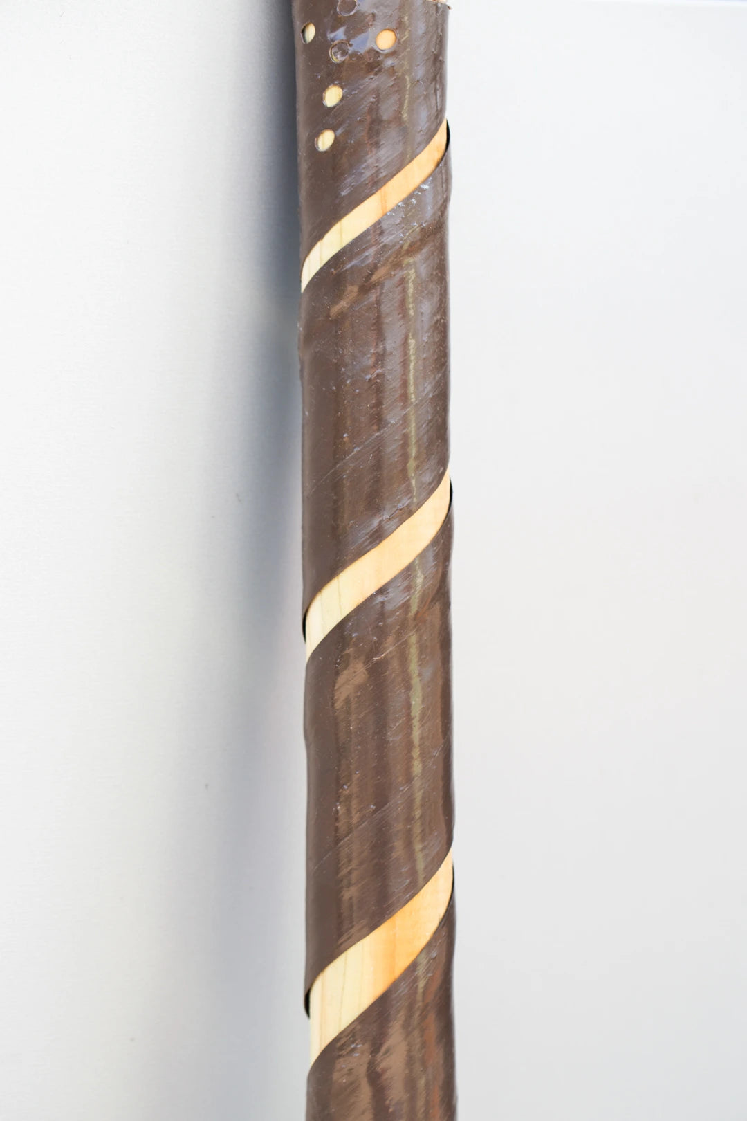 A tree stake and guard to support growing trees.